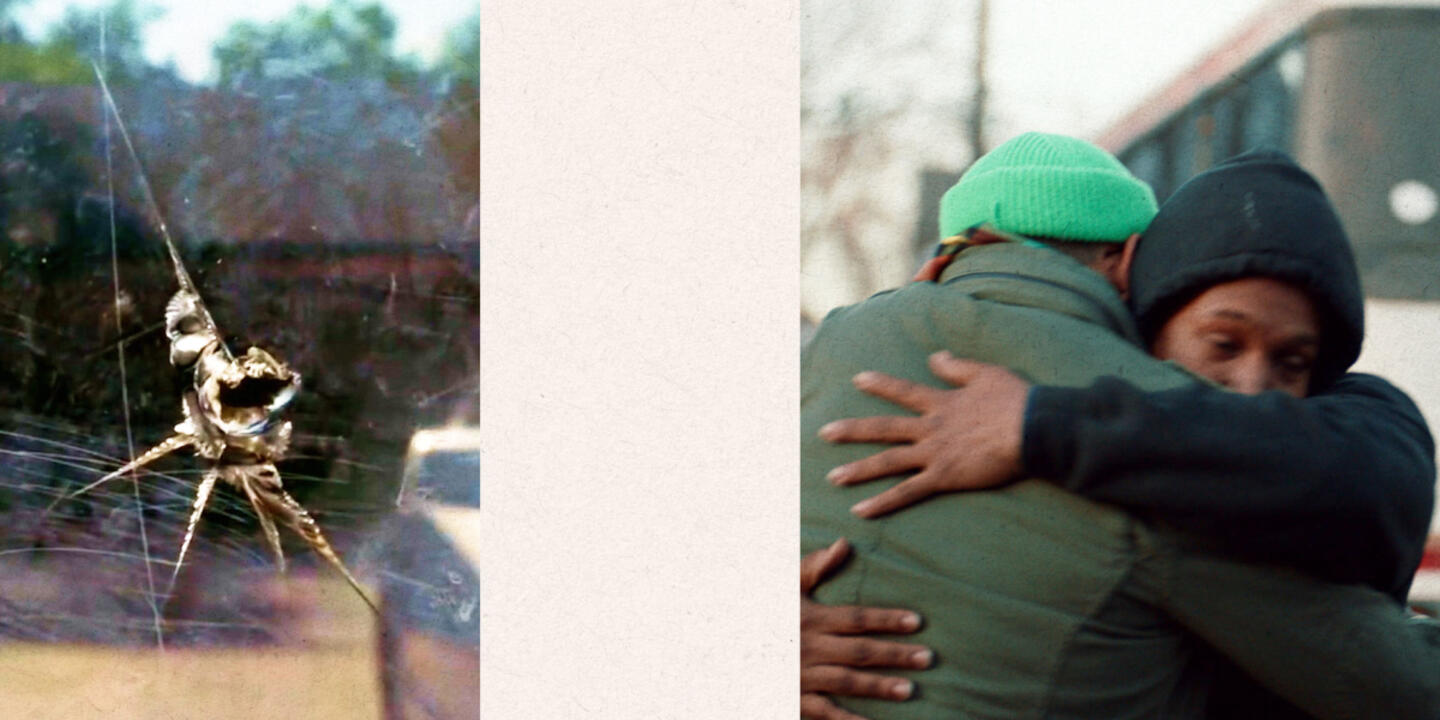 Hole in glass with two people hugging.
