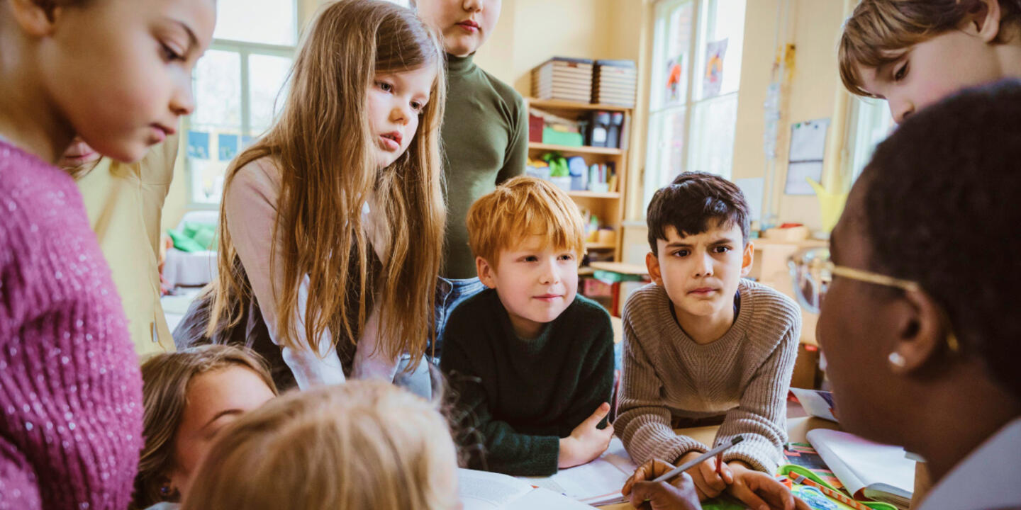 School children focusing on their teacher.