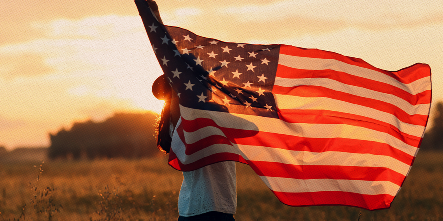 A person holding the American flag.