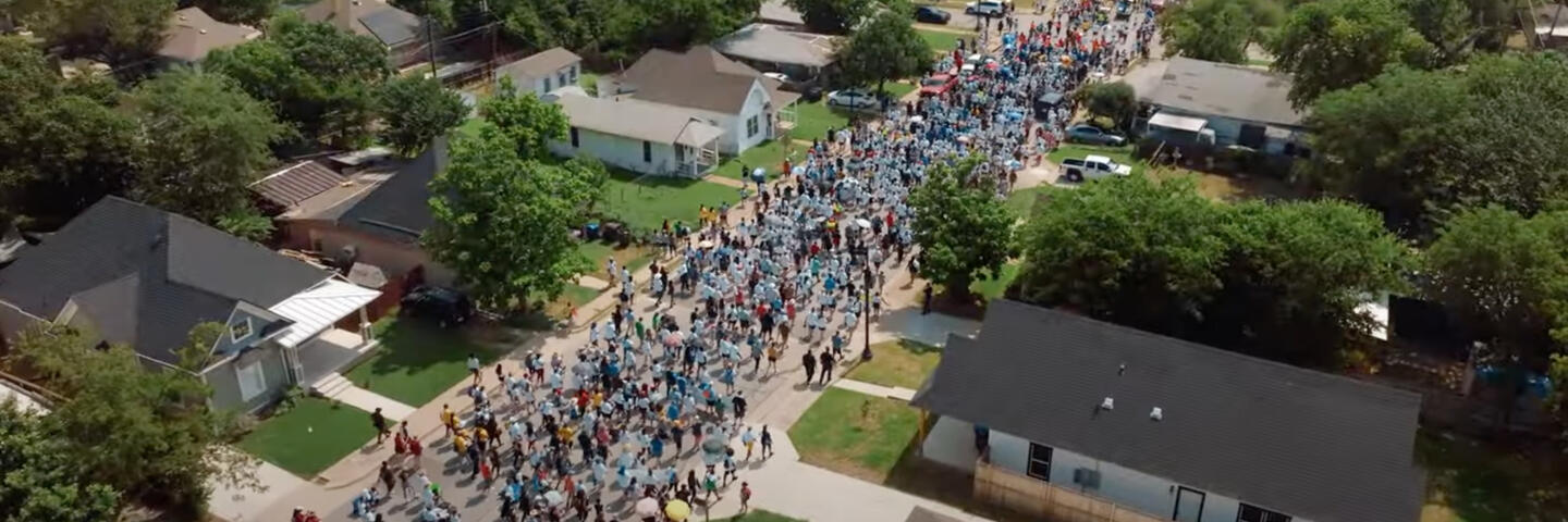 Hundreds of supporters walk behind Opal Lee during her March for Freedom
