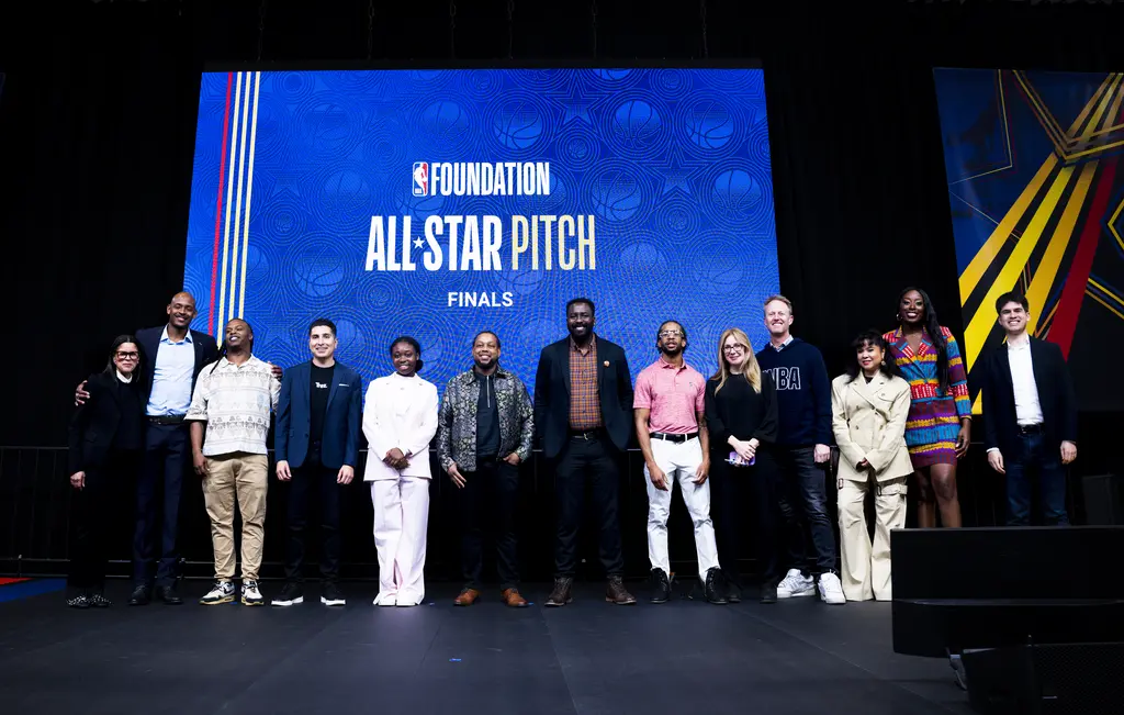 Group of people standing on stage.