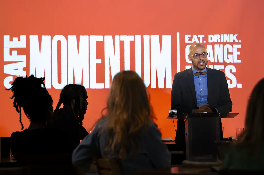 Benjamin Wills speaking at Cafe Momentum Atlanta's opening.