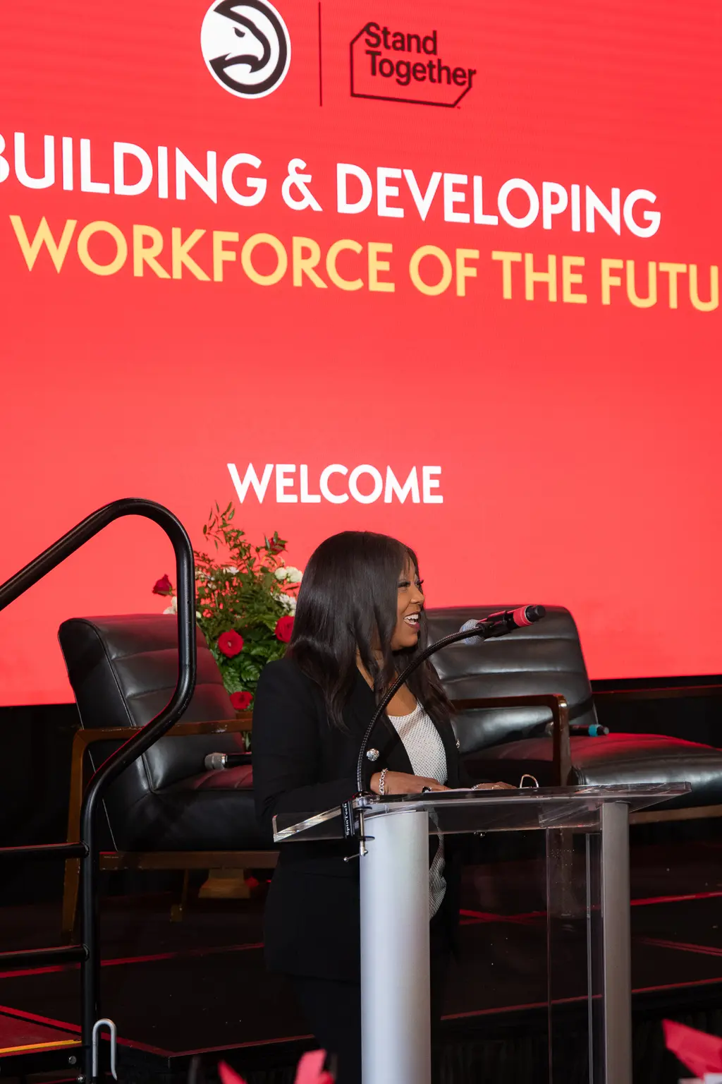 Camye Mackey speaking at an event.