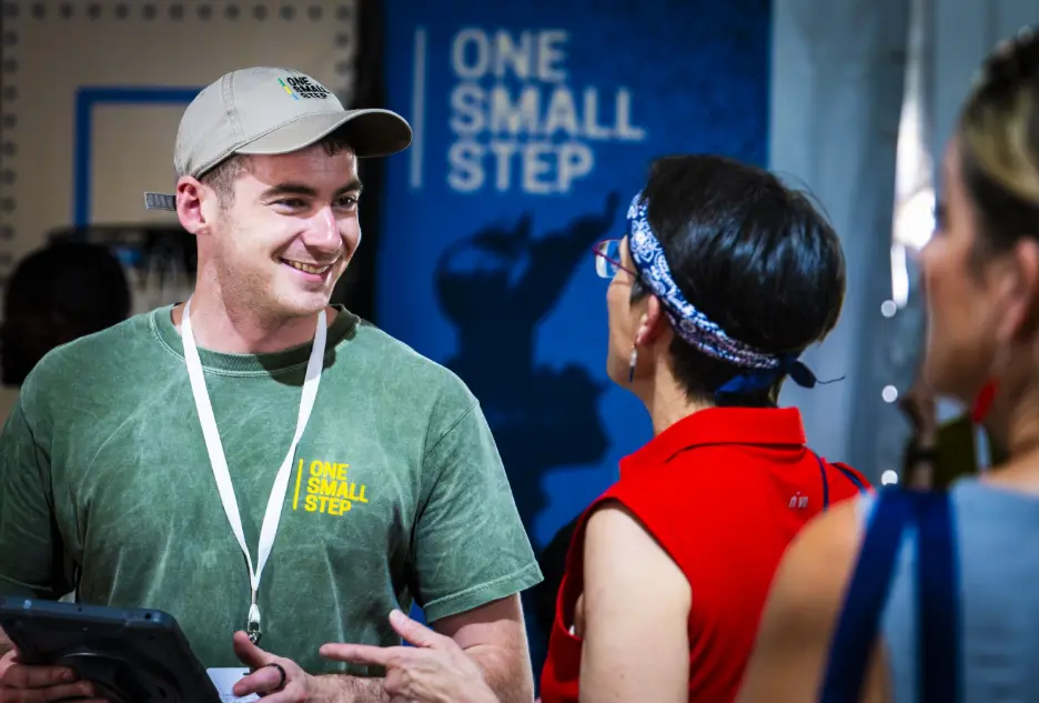 An Americans for Prosperity staffer talks with a visitor to the Great American State Fair.
