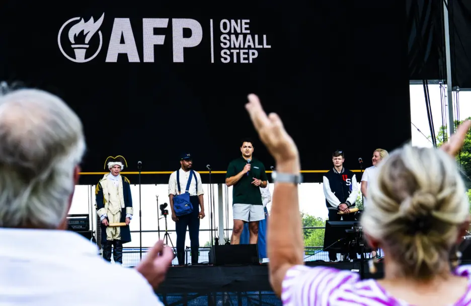 Daniel Bassali, vice president of public affairs at Americans for Prosperity, and Katelyn Bledsoe, vice president of external affairs at AFP, speak at the group's exhibit at the Great American State Fair.