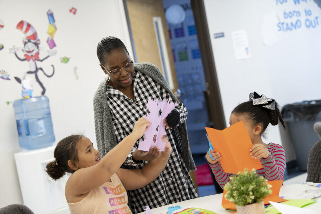 A teacher works with students on a hands-on, project-based learning activity. Due to The Learning Outpost's 1-to-10 teacher-to-student ratio, each student has the opportunity to receive an individualized curriculum.