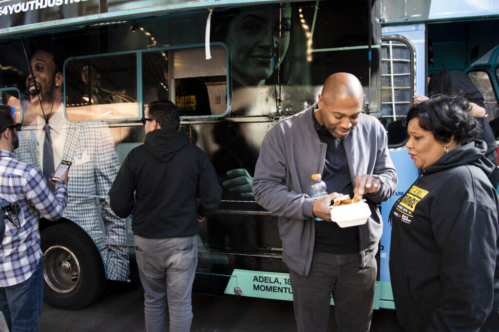 People outside of the Cafe Momentum food truck