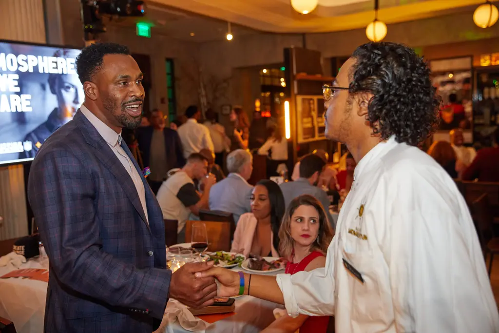 Steven Jackson shaking hands with Priest