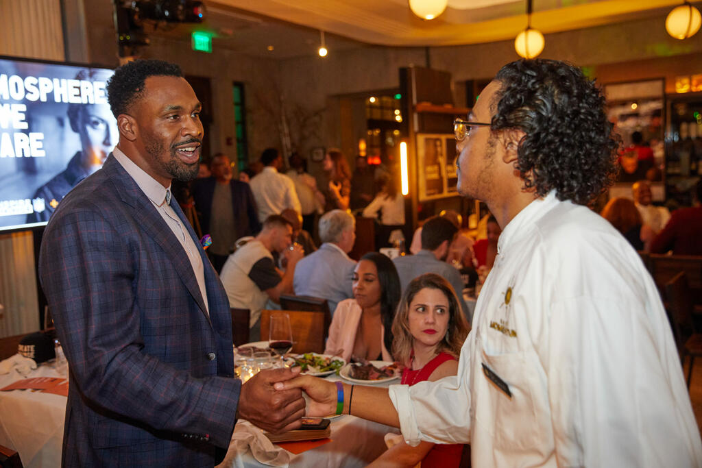 Steven Jackson shaking hands with Priest