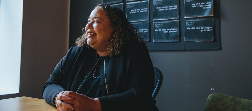 Sandee Kastrul, I.C.Stars Co-founder and CEO, smiling sitting at her desk