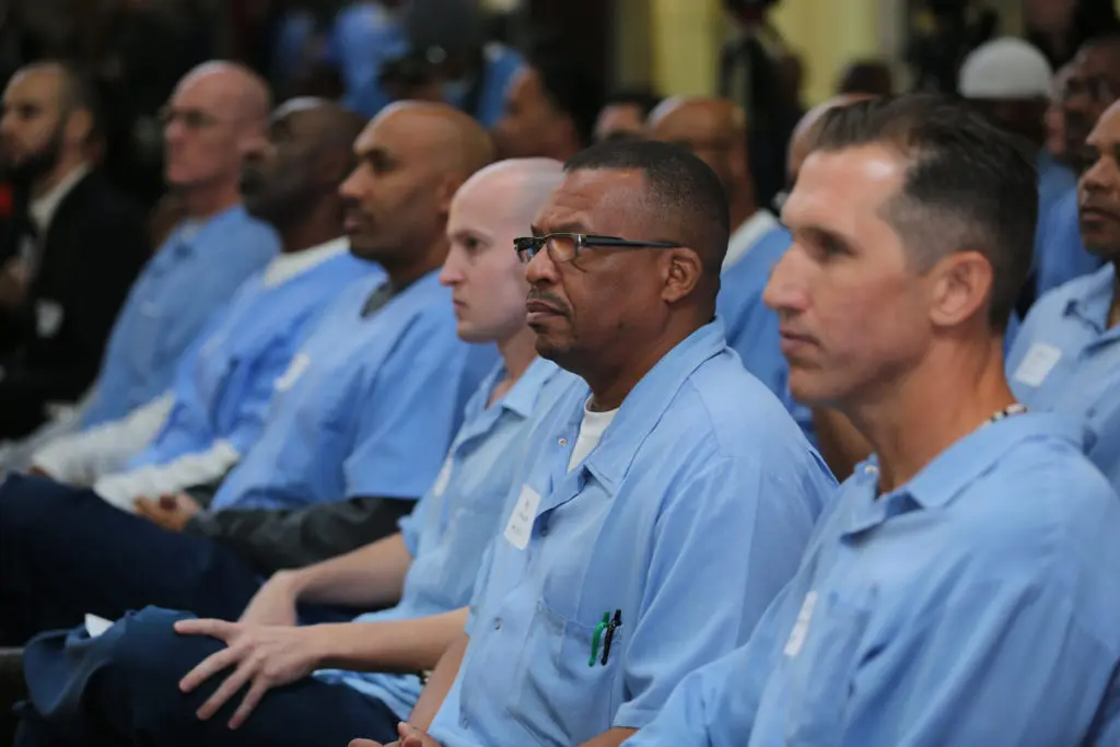 A group of men sitting in a room