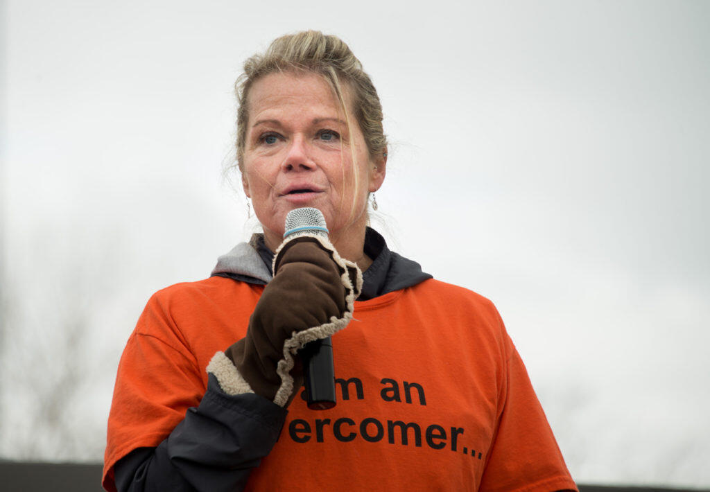 A Prison Fellowship Academy Alumni speaks on a microphone