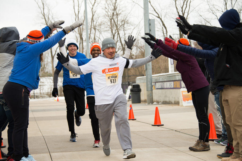 A group of race participants reaching the end of the course