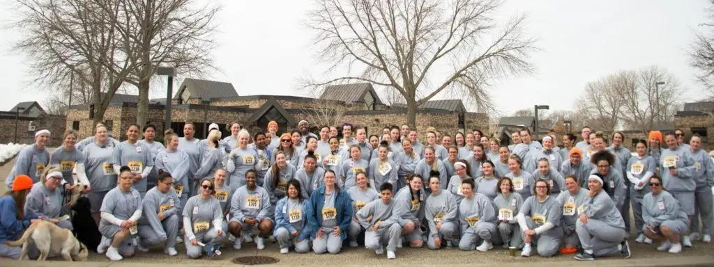 A group photo of race participants and volunteers