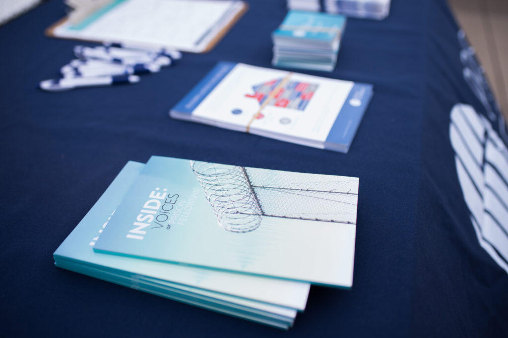 Books titled 'INSIDE VOICES' on a display table.