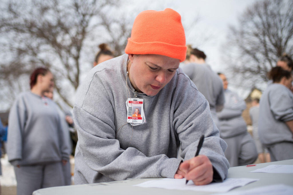 A race participant fills out a form