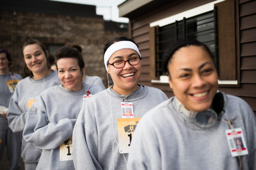 Female inmates in a single file line