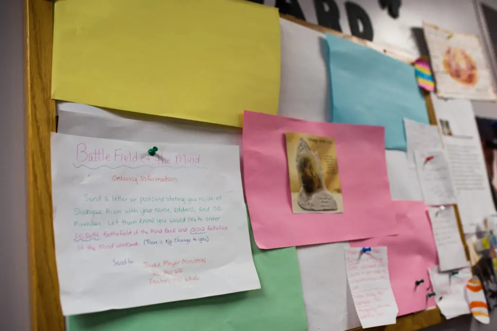 Small note cards pinned to a wall