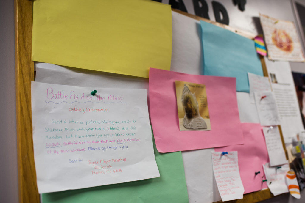 Small note cards pinned to a wall