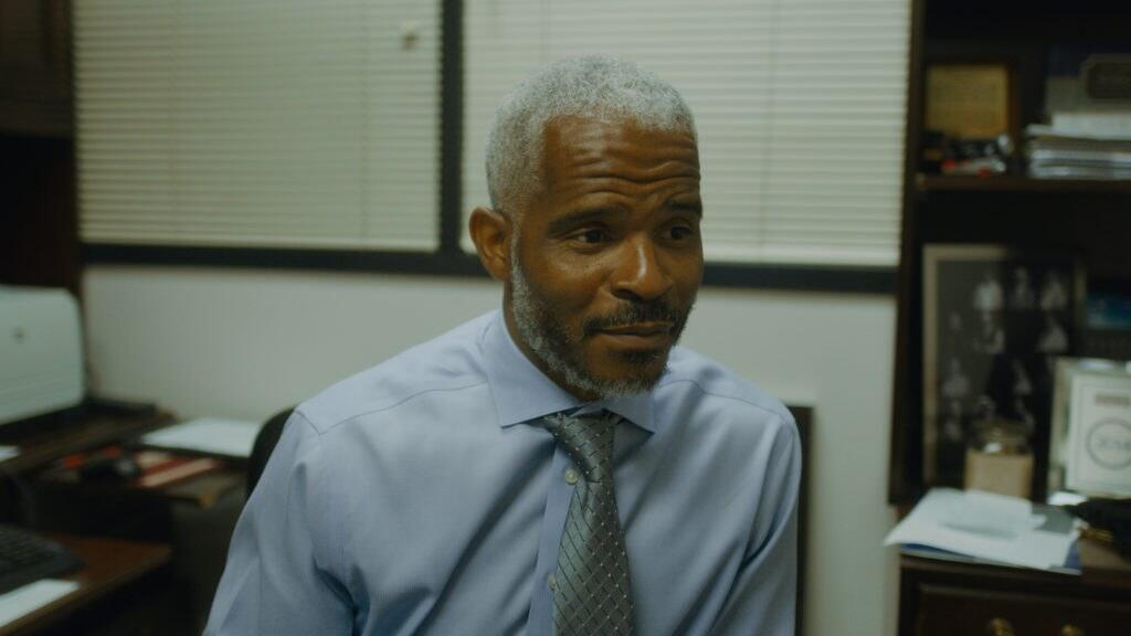 Richard Miles sitting at a desk