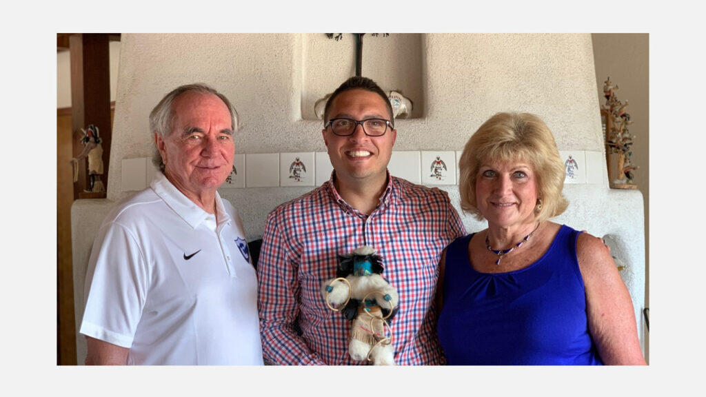 Ron and Peggy Toya pose for a photo with Chris Grozev