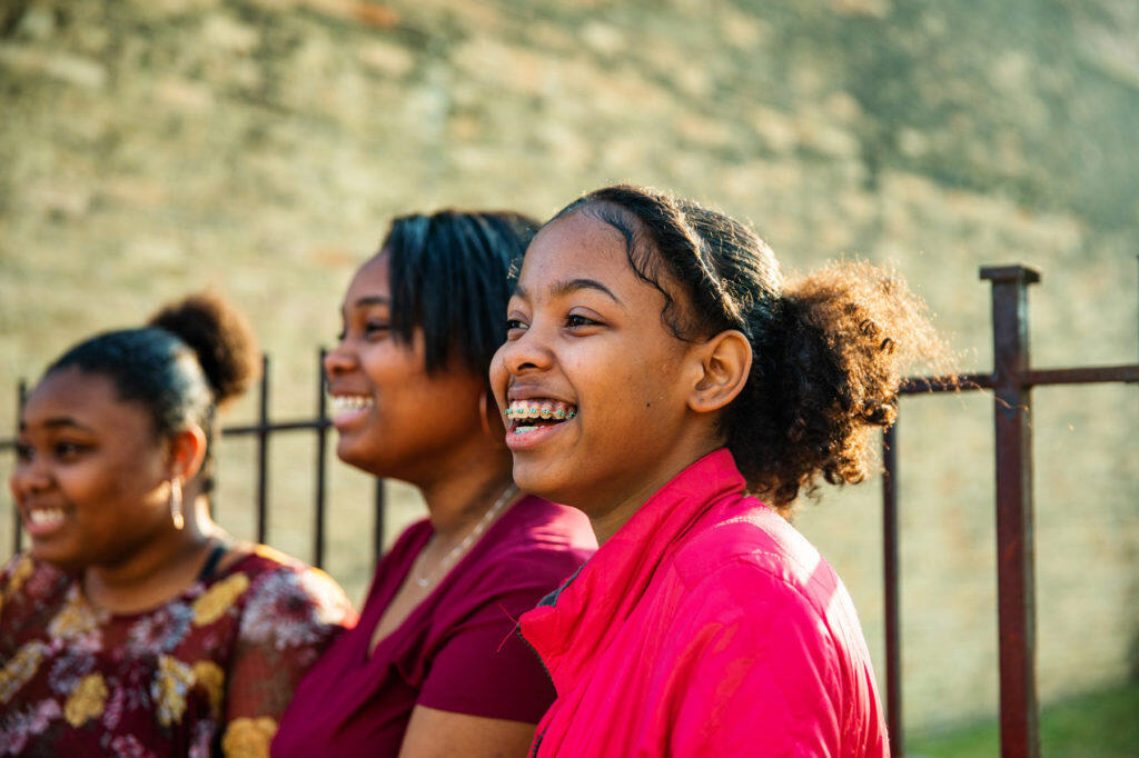 Three children smiling