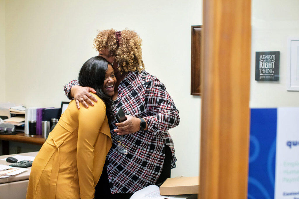 Austiana Jackson hugs Executive Director Gerry Houze