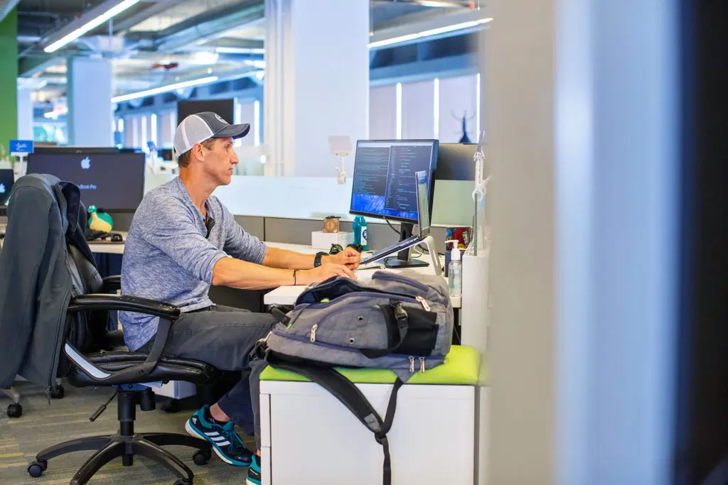 Chris Schuhmacher working at a desk in an office