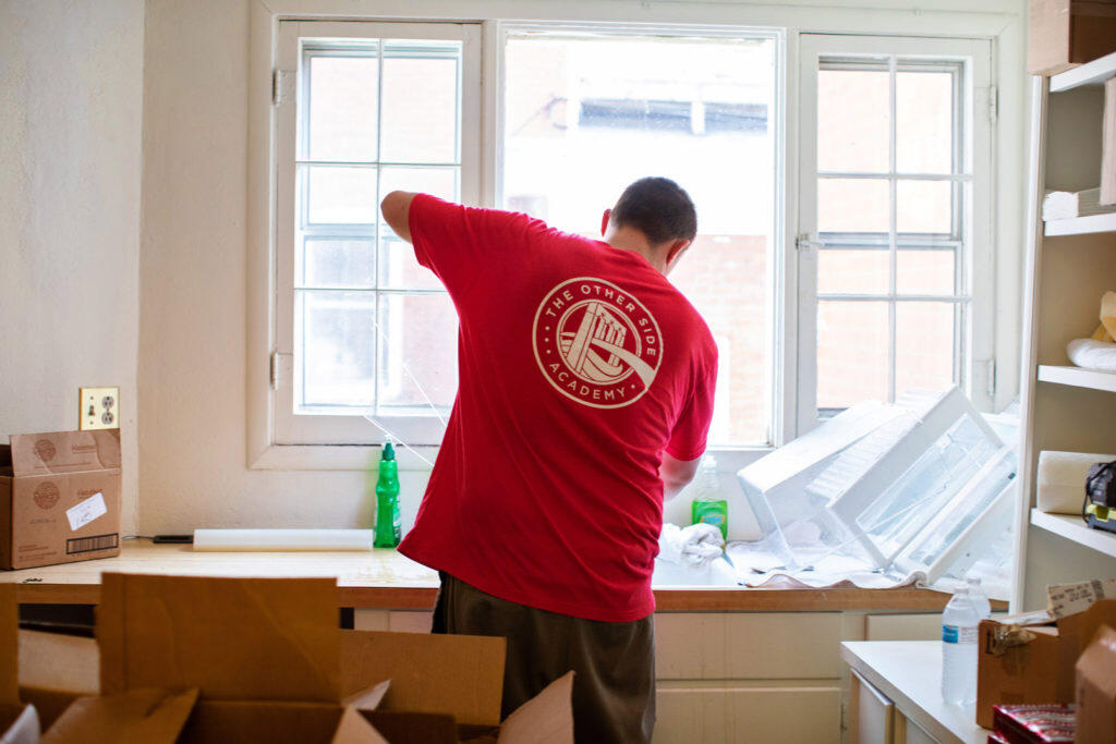 A man assembling a shelf