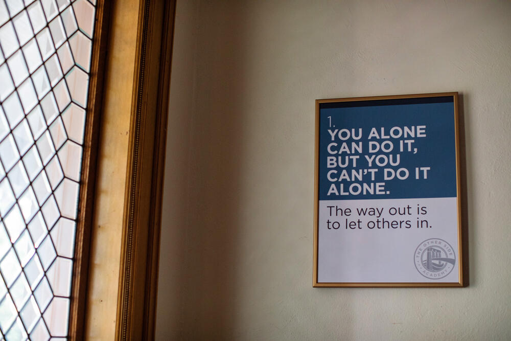 A sign reminding people that it's important to let others help you