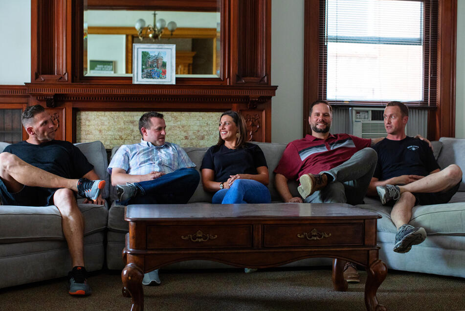 A group of The Other Side Academy students sitting on a couch