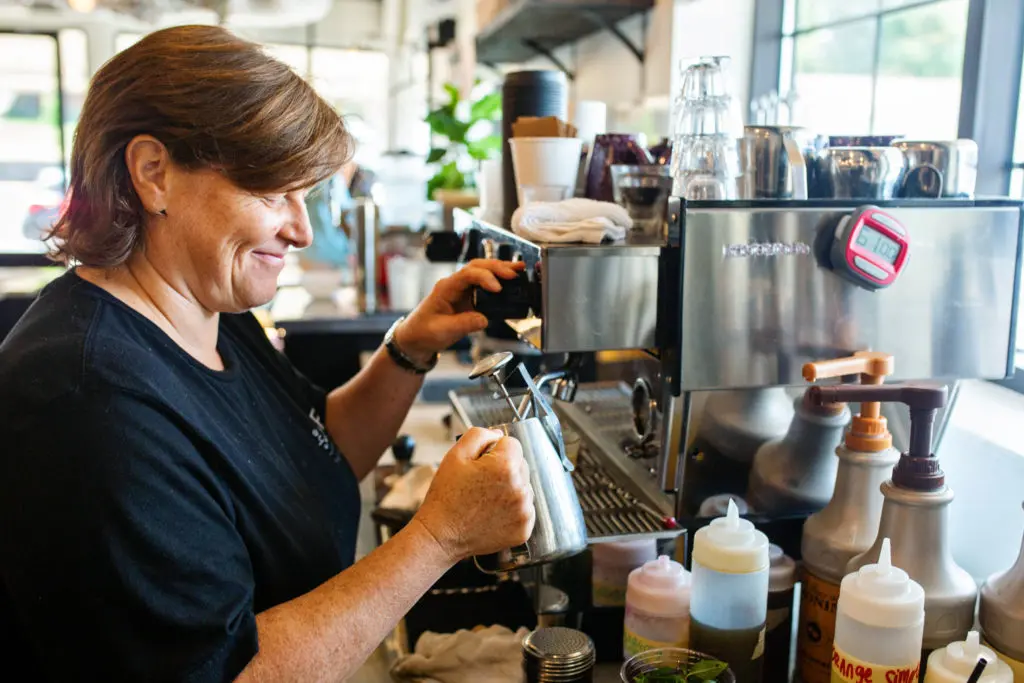 Thistle Farms staff member making a coffee order