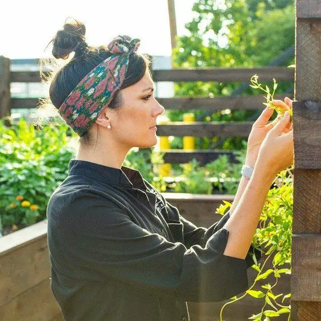 Courtney Sobieralski inspects a plant