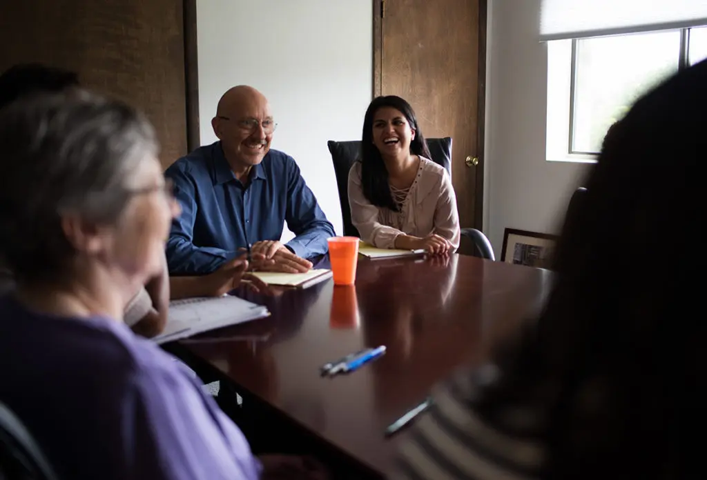 A group of people in a meeting