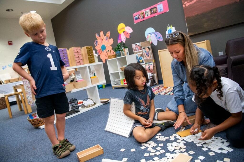 A teacher with students engaged in a lesson