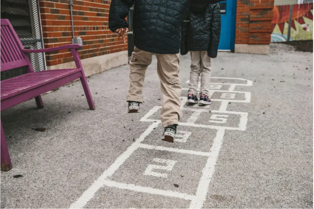 Kids playing hop scotch