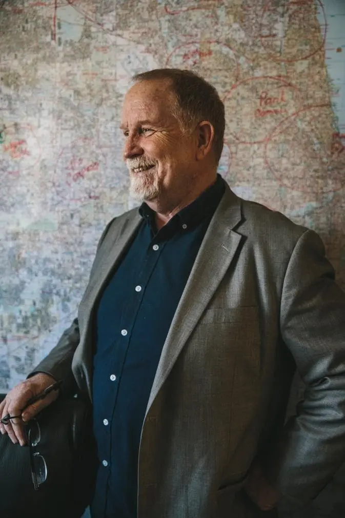 Dr. Anderson with a map of Chicago behind him